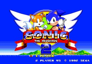 Title screen for Sonic the Hedgehog 2, the game for Sega Genesis. Sonic and Tails are posing behind a banner that says “Sonic the Hedgehog” and in front of an emblem with wings. The option “1 player” is selected