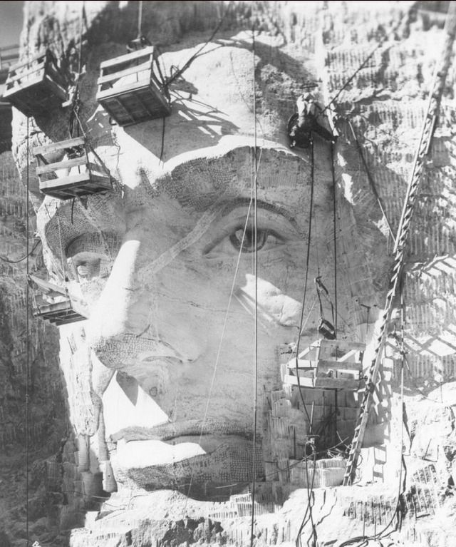 Working on Abraham Lincoln’s face on Mount Rushmore, 1937.  