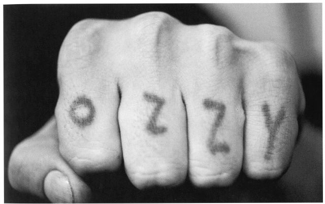 While in prison in 1966, Ozzy tattooed his name across left knuckles with a sewing needle
