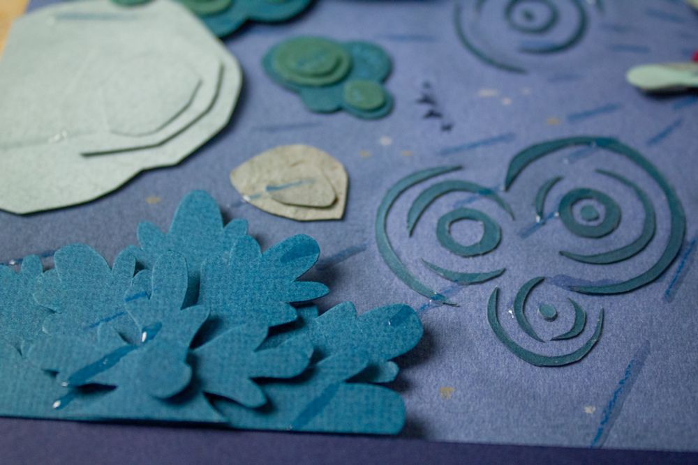 Picture of paper details: a spruce seen from atop, and some rain puddles.