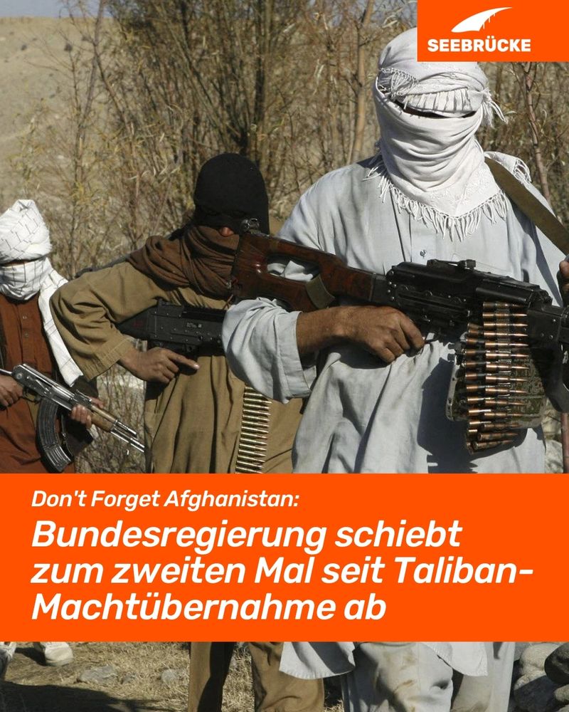 Photo of three masked people with weapons. An orange box reads ‘Don't Forget Afghanistan: German government deports for the second time since Taliban takeover’. In the top right-hand corner is the Seebrücke logo in white on orange.