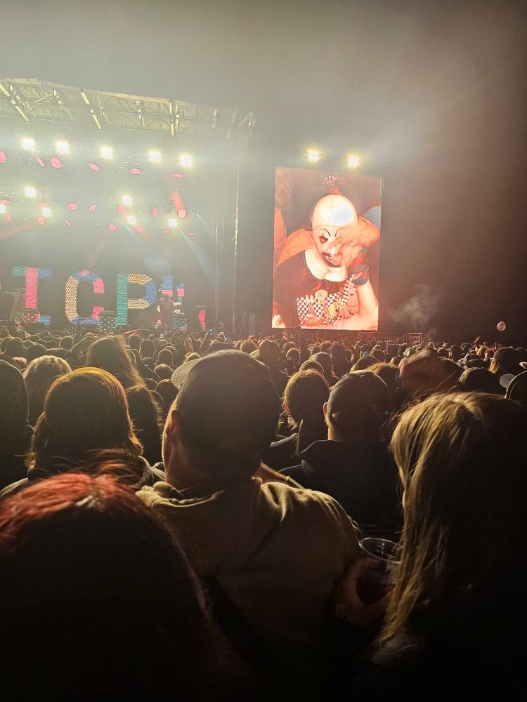Insane clown posse performing with art the clown from terrifier on the big screen