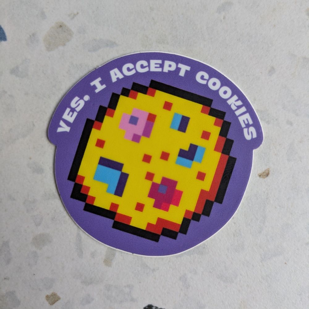 A purple sticker featuring a pixel art cookie and text reading "yes, I accept cookies"