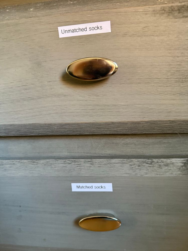 Two drawers, one labeled “Unmatched socks” and one labeled “Matched socks”