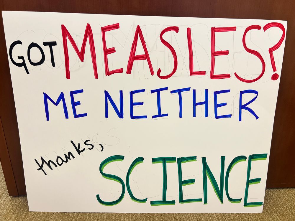 My handmade sign which reads:
Got measles? 
Me Neither
Thanks, Science