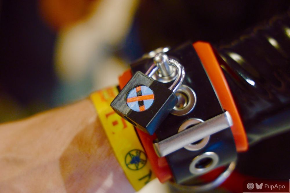 Close up of a wrist cuff with a tagged locked with the X0 logo