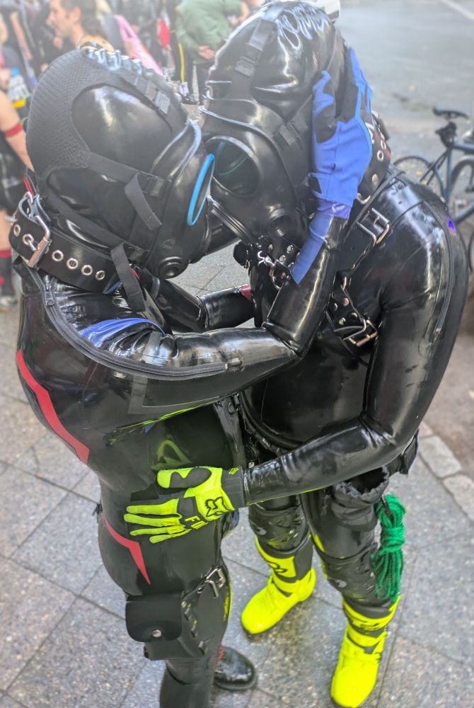 Two latex Drone connecting heads entering symbiosis