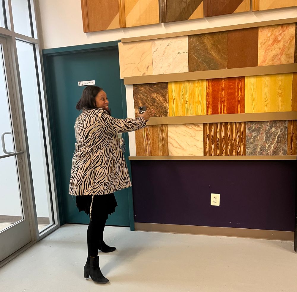 Rashida looking over stone samples.