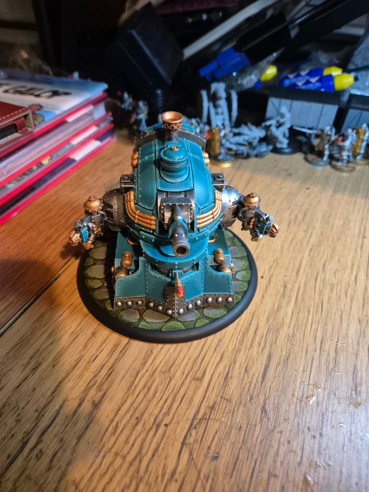 A Warmachine Railless Interceptor model, a steam-powered contraption with a gun on each side that looks like it has its arms out for a Hug. A 40-ton armoured Hug.