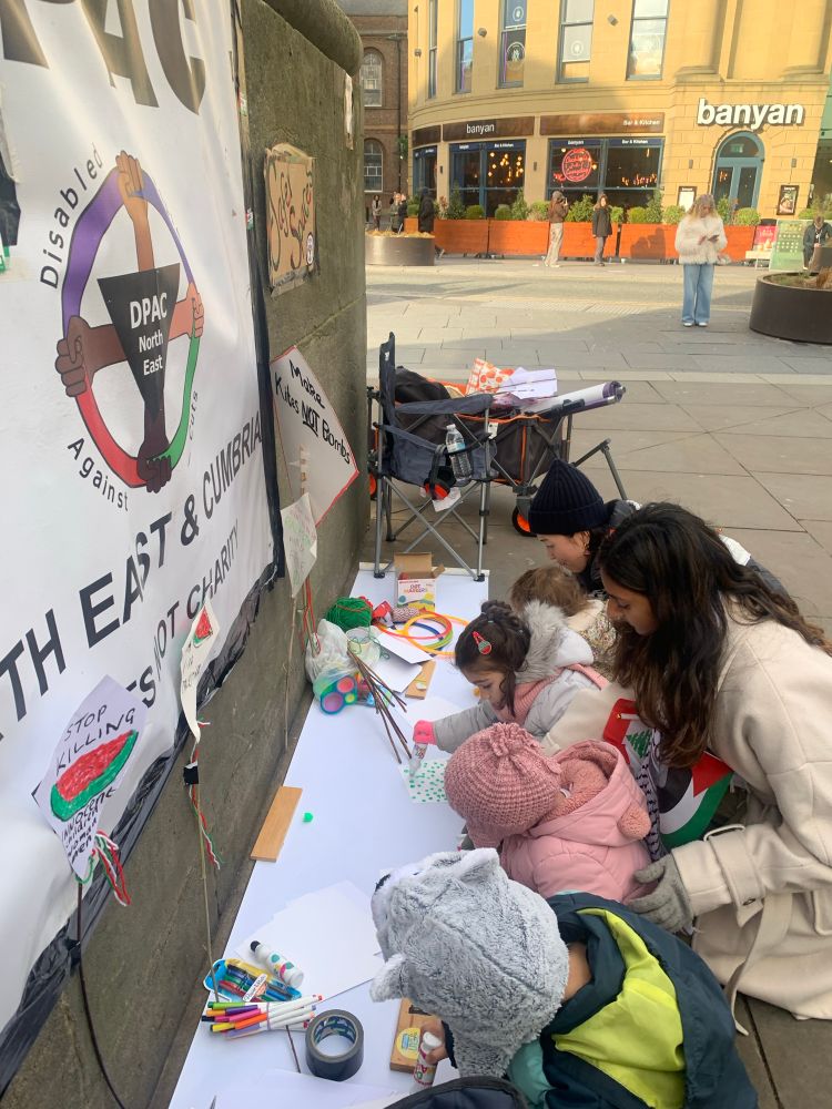 Under the DPACne banner our volunteers work with a brightly dressed group of under 5’s. Today we produce “kites of freedom” on Palestinian healthcare day