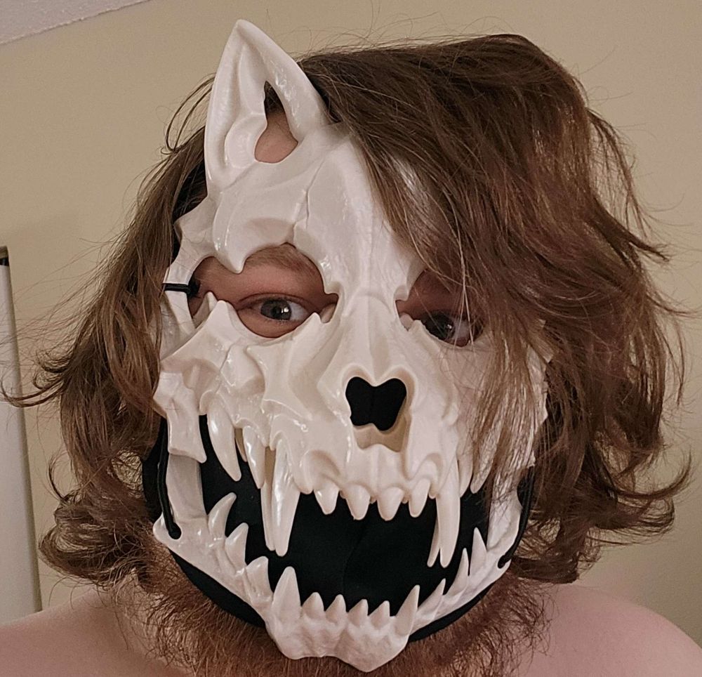 Enny wearing a skull mask with ears