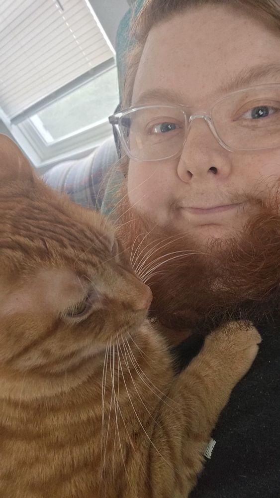 Skye and her orange cat Elgin
