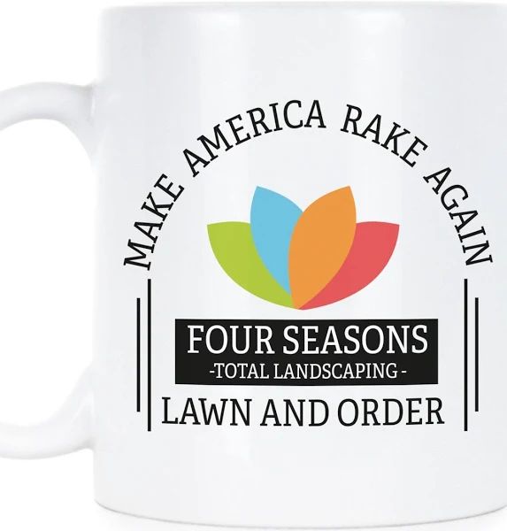 A white promotional mug with a multicoloured 4-petal lotus (green, blue, orange and red petals) and the words, Make America Rake Again followed by the name of the business, Four Seasons total landscaping, and then followed by the words, lawn and order.