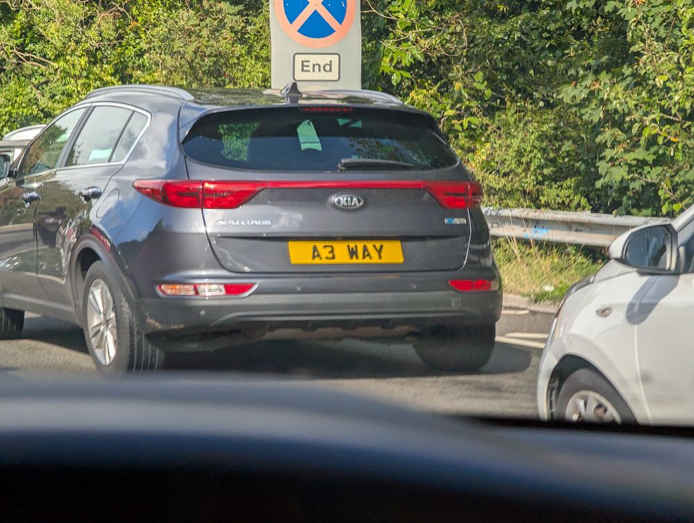 A personalised license plate that reads "A three way".