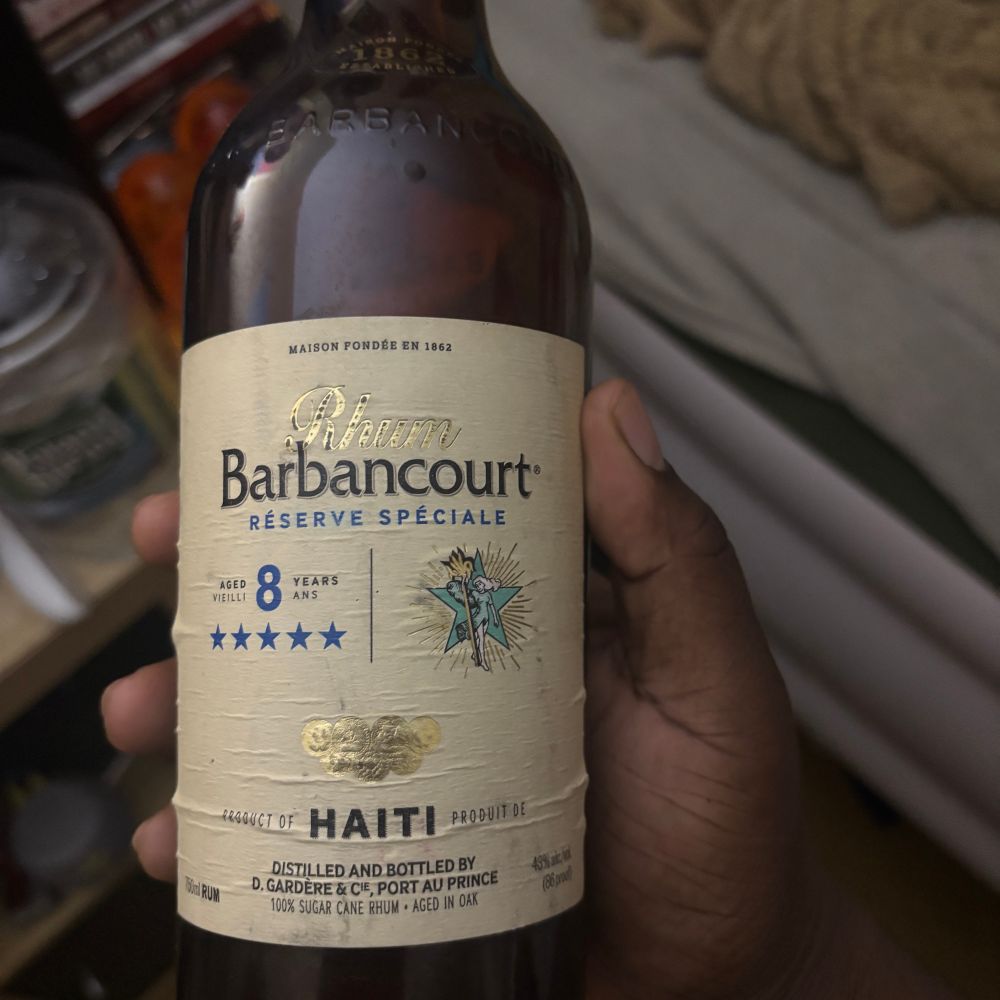 me holding Barbancourt