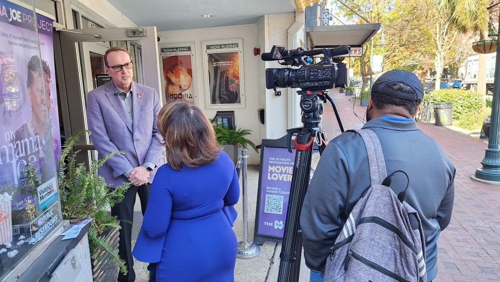 Judi Gatson interviews Julius Fridriksson outside of the Nickelodeon Theater in Columbia South Carolina, just before a free screening of the documentary My Mama Joe: Hope and Help, held on Friday, November 7.
