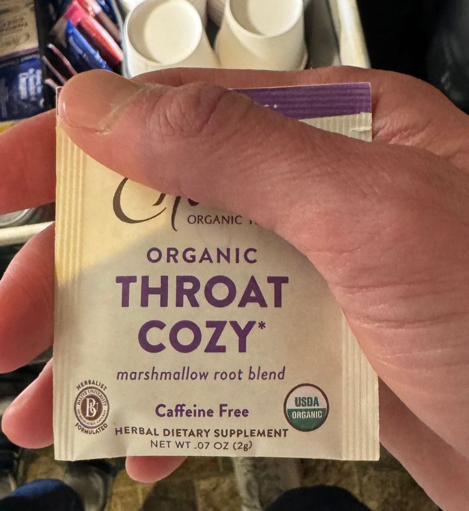 Tea package that says: ORGANIC THROAT COZY marshmallow root blend Caffeine Free HERBAL DIETARY SUPPLEMENT NET WT .07 OZ (2g) USDA ORGANIC