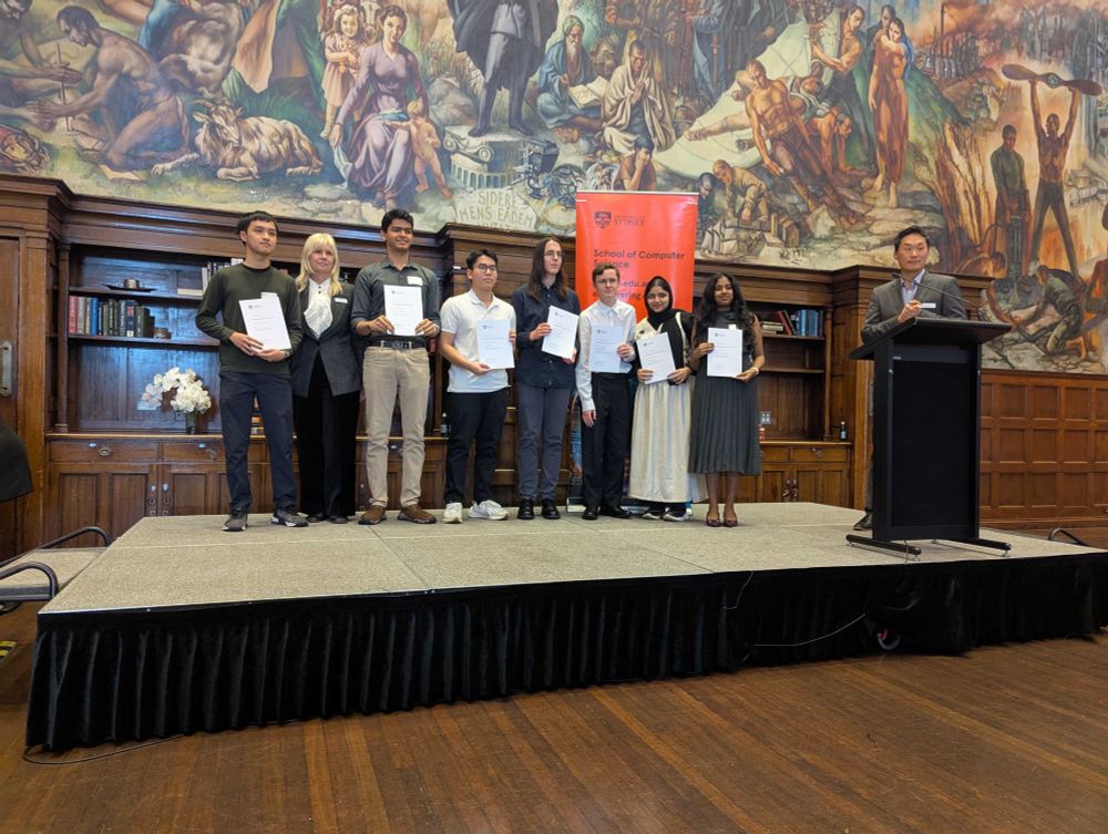 A group of the students receiving an award at the ceremony, on stage: presented by Prof. Natialiia Stratiienko and Prof. Jinman Kim.