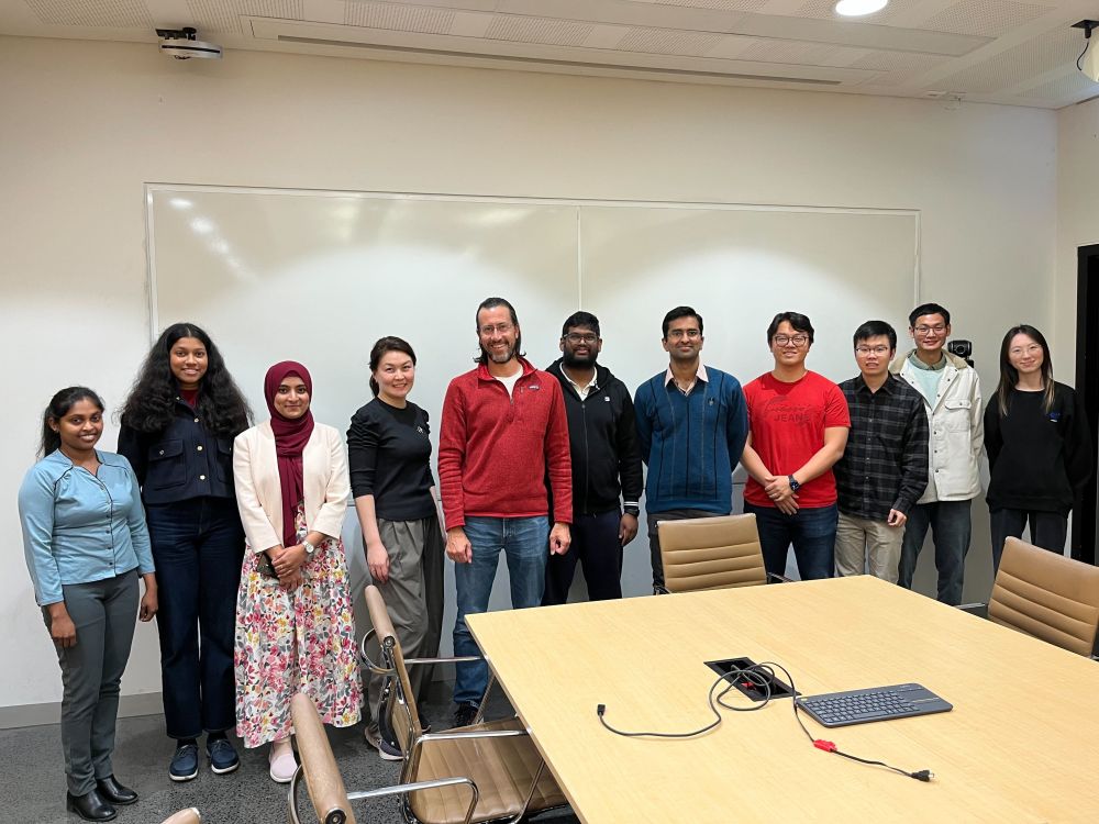 The 3 Minute Thesis School heat participants, with the two jury members from the School (A/Prof. Julian Mestre and Dr. Zhanna Sarsenbayeva) in the middle.