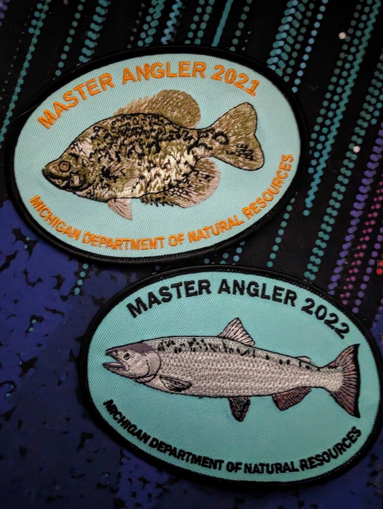 Michigan Department of Natural Resources master angler badges for 2021 and 2022.