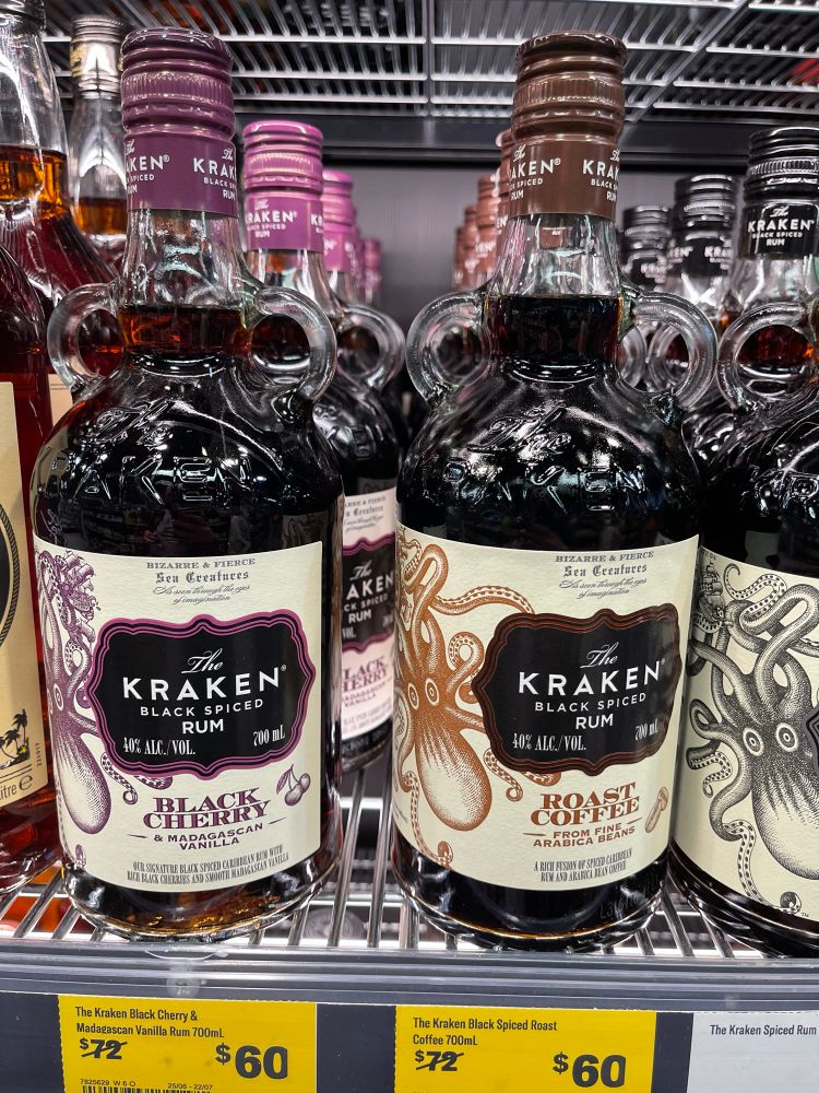 Bottles of Kraken Rum on a store shelf
