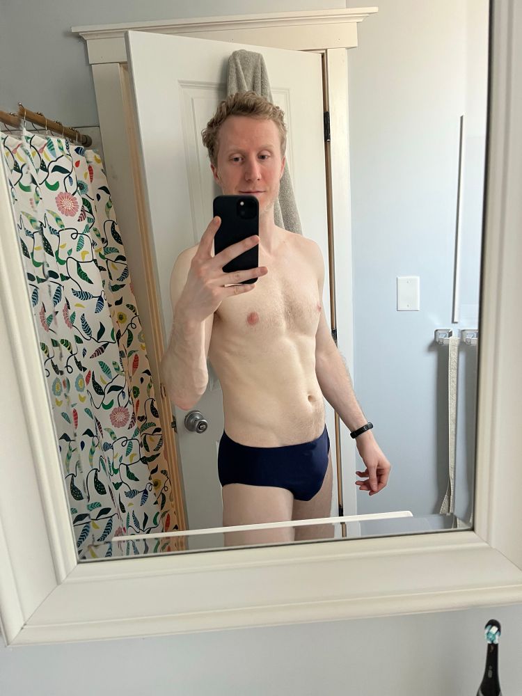 Mirror selfie of me wearing a navy speedo