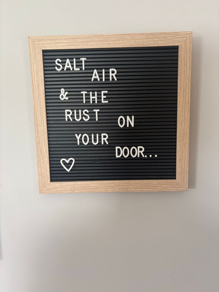Message board with the lyric “salt air and the rust on your door” on it 