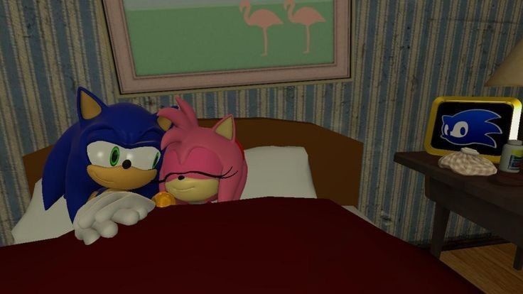 sonic et amy rose dans un lit, ils font un calin et sont amoureux