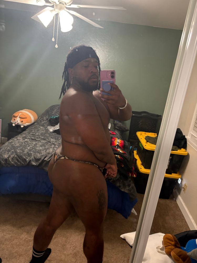 Me posing in the mirror in a thong