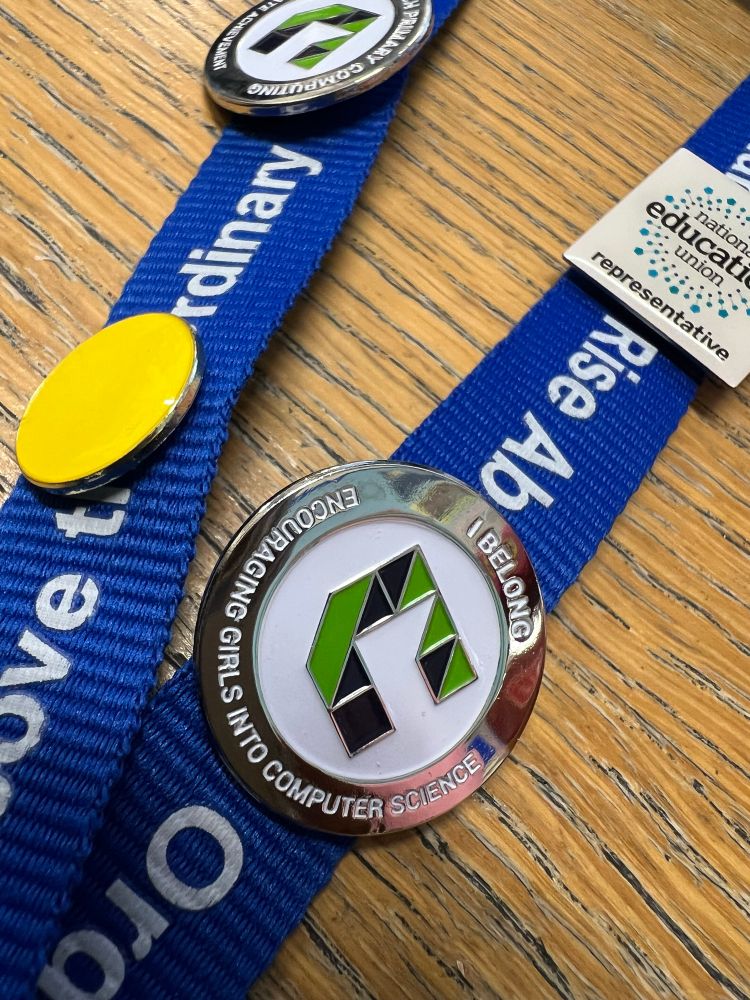Close up photo of an ‘I Belong - Encouraging Girls Into Computer Science’ badge on a lanyard. 