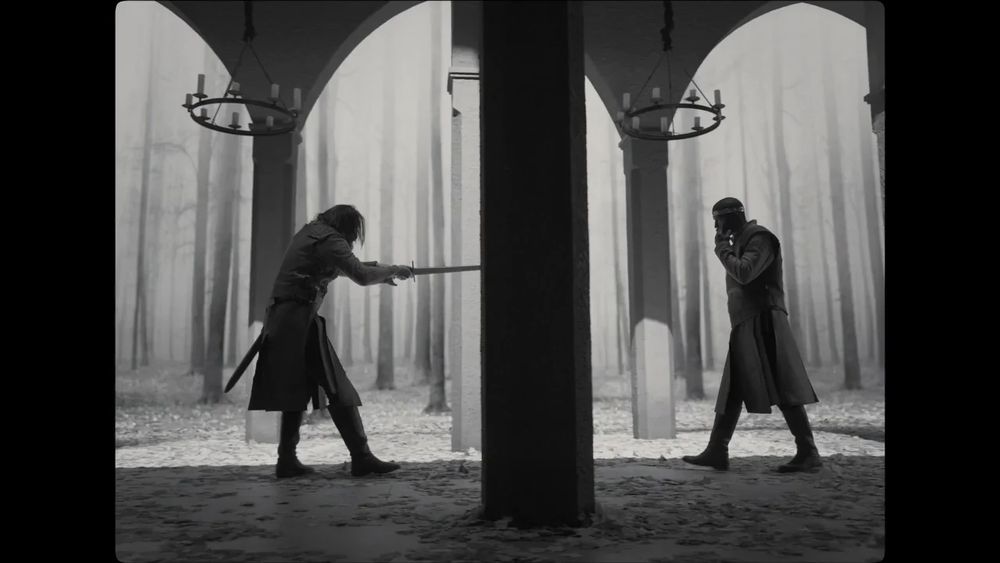 Siward tries to kill Macbeth in his throne room. Trees are seen in the background.