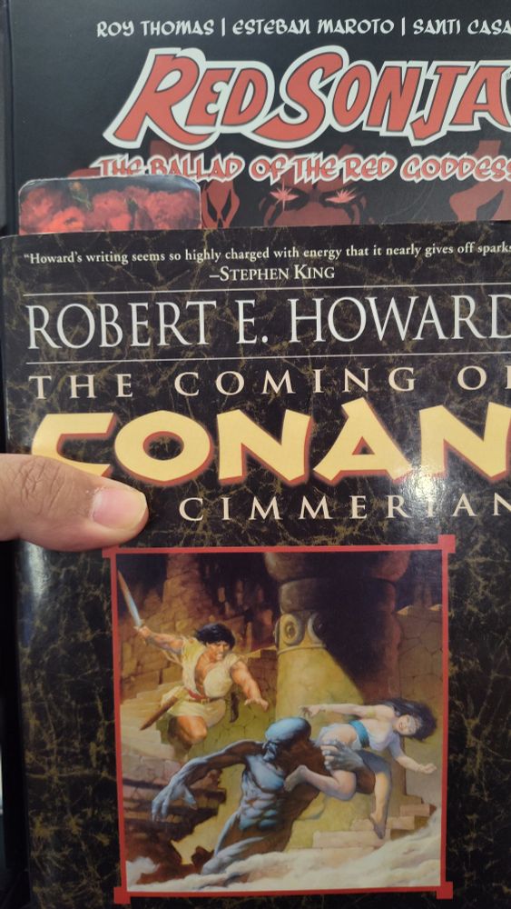 a Red Sonja comic and a Conan the Barbarian book