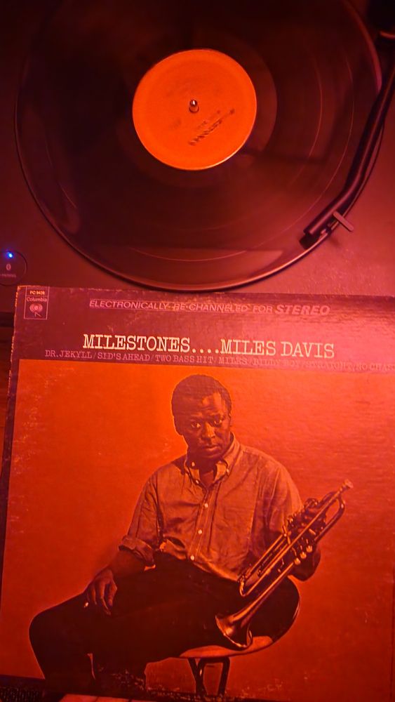 Album cover and vinyl disc of Miles Davis' Milestones record