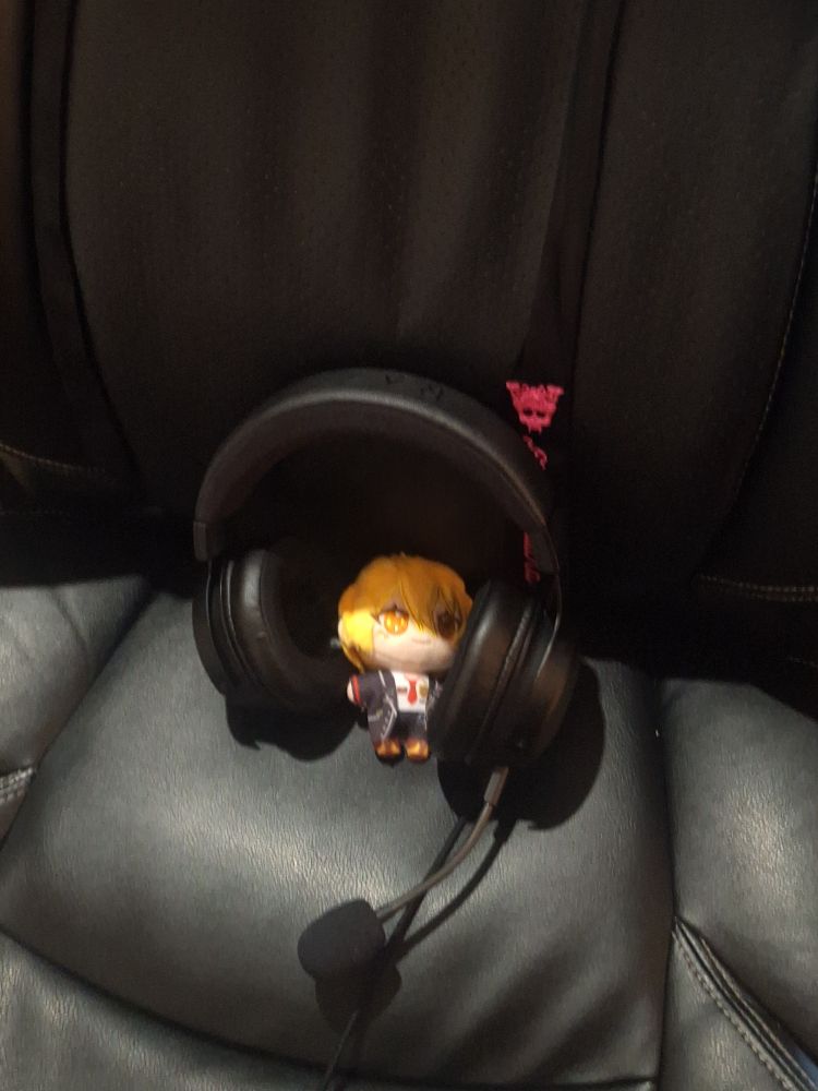 chibi don plush on my chair with headphones. gamer don.