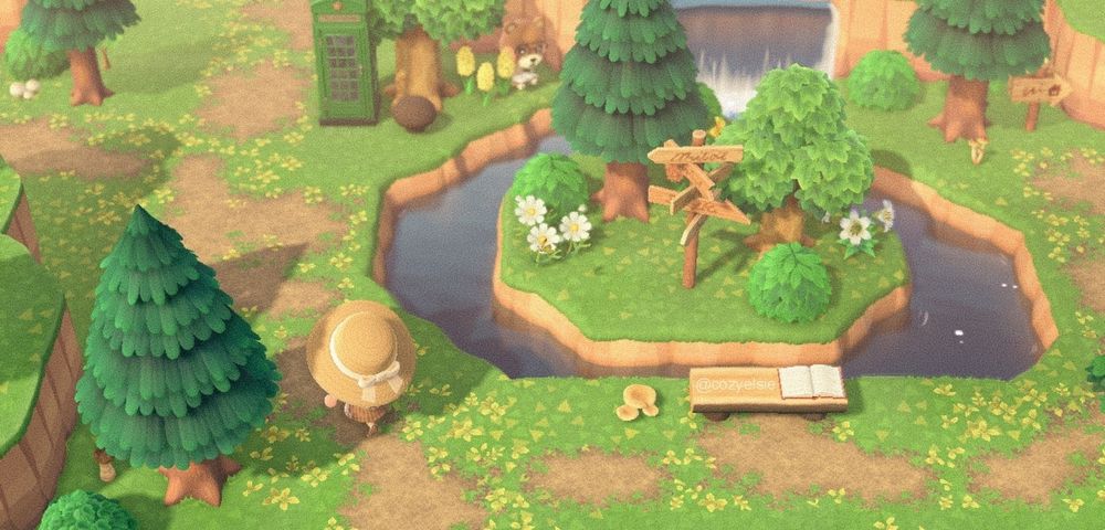 picture taken from my island on animal crossing new horizons. showing the entrance to the island. there's a dirt path going up to the left corner and splitting left and forward, then going to the right up to the right corner, in the middle is a piece of land surrounded by a little stream coming from the water fall behind it. there's a log bench with a book open on it, a destination sign on the separate piece of land, a green phone booth near the top left. there are trees, bushes, flowers, and mushrooms scattered around. a brown bear villager, maple, sits up between where the waterfall is and the phone booth, reading a book. my character is walking the path to the left wearing a tan gardening hat with a white bow.