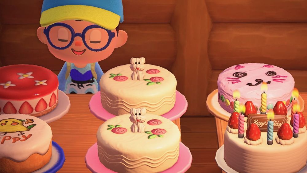 Animal Crossing New Horizons resident standing before some yummy cakes