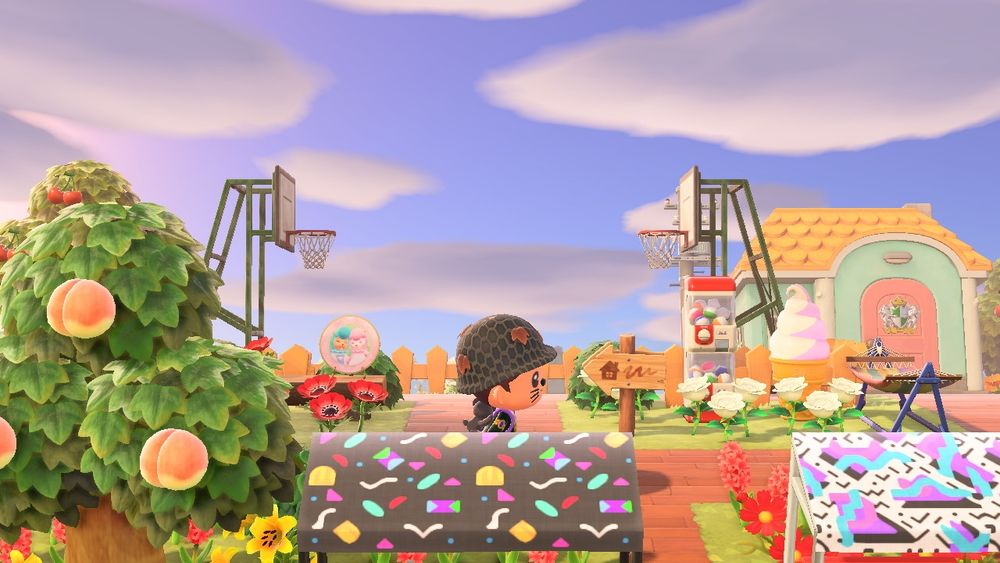 Animal Crossing New Horizons resident running past two basketball hoops