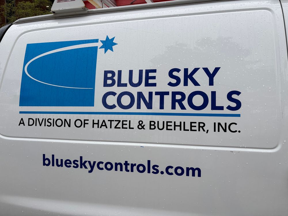 Construction van with advertisement and company name “Bluesky Controls” 