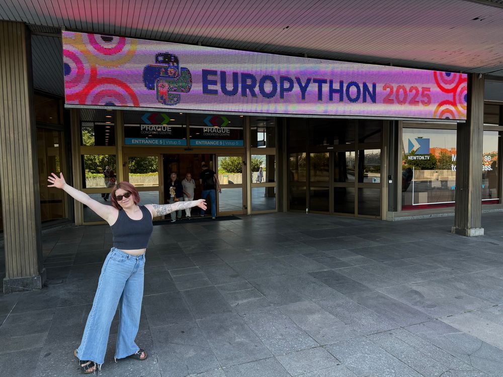 Savannah posing outside of the convention center at EuroPython 2025