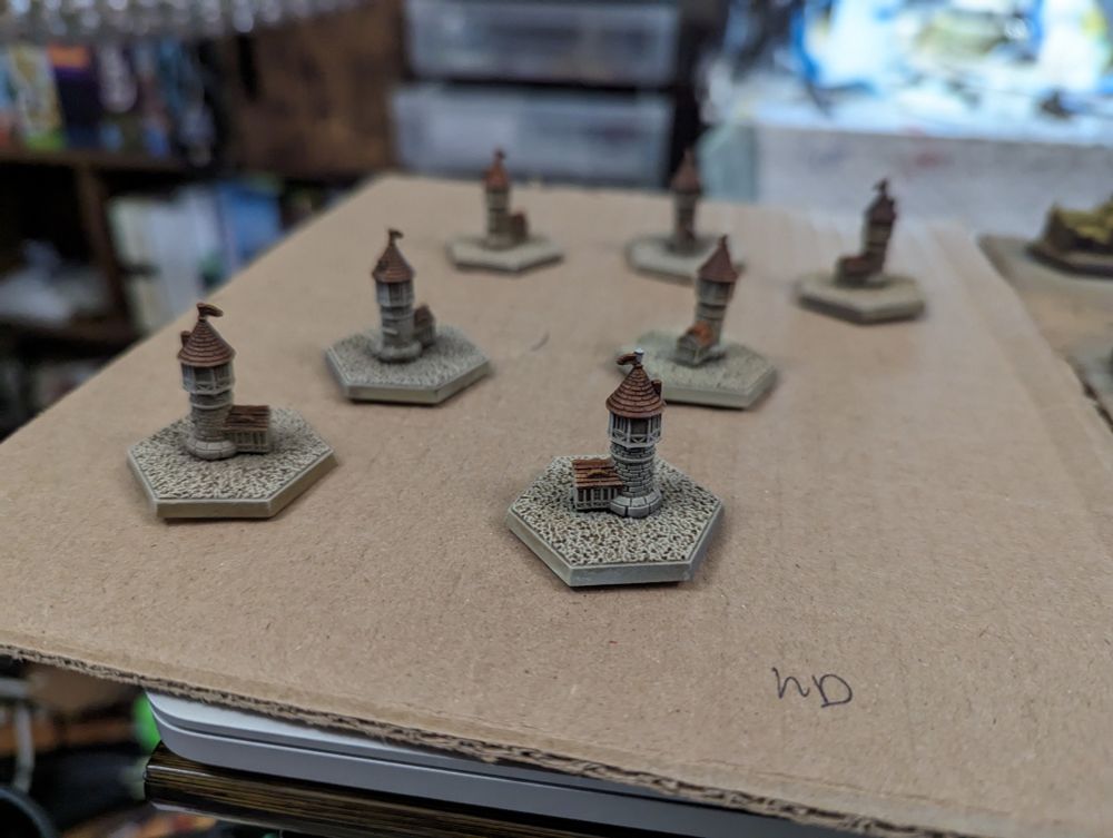 The "Watchtower" building after priming, airbrushing, washing dry brushing and painting the roof to match the color of the in-game graphics.