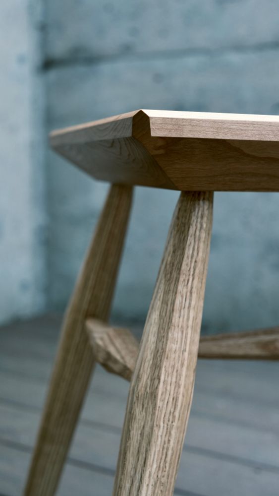Close up of the bevels on the seat on a cherry and oak stool