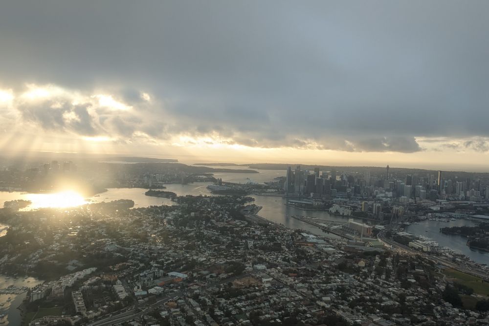sydney harbour with bridge, opera hoise and city at dawn