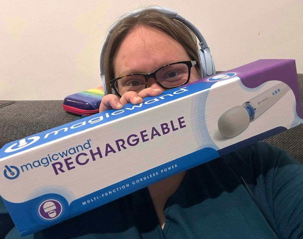 Zel holds up her new hitachi wand