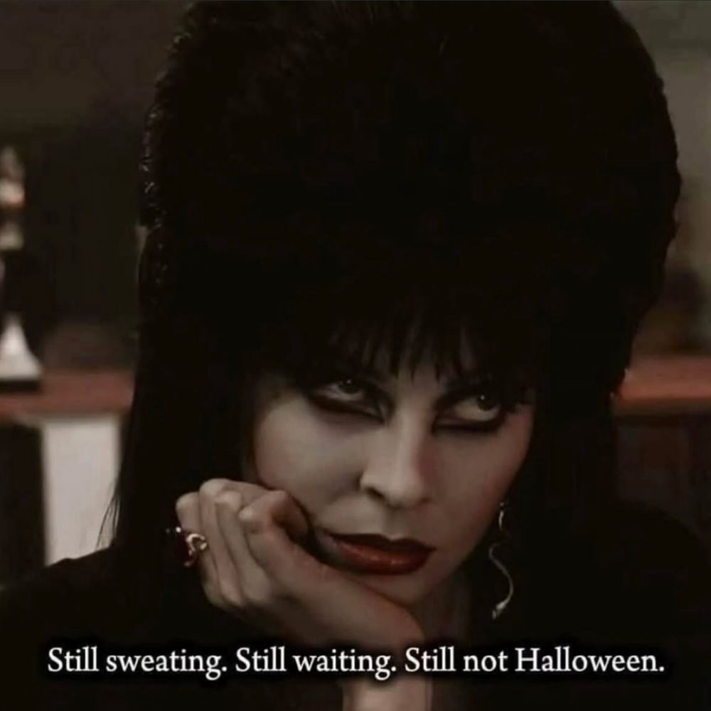 A woman looking angrily with the caption "still sweating, still waiting, still not halloween".