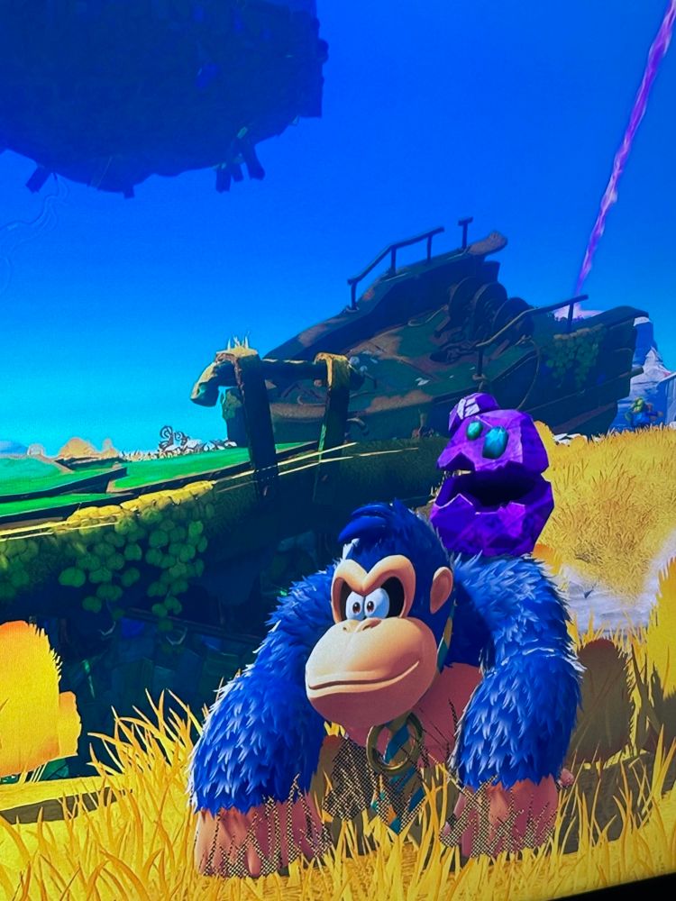 Donkey Kong from Donkey Kong Bonanza with blue fur and a blue and yellow striped tie.