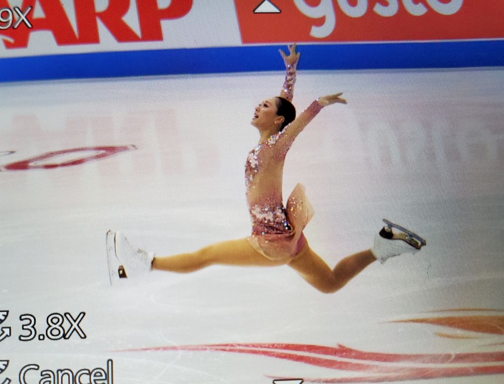 photo of my camera screen showing wakaba smiling and in mid-leap