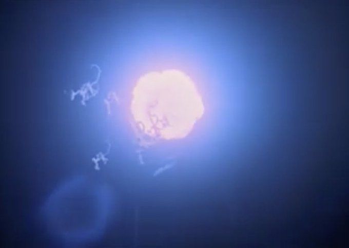 A screenshot from an official color film showing the TIGHTROPE explosion milliseconds after detonation as a glowing ball of plasma in the sky.
