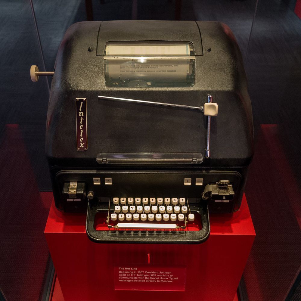 A color photograph of a black and boxy ITT Intelex Teletype L015, used on the Washington end of the hotline, on display at the Lyndon Baines Johnson Library and Museum in Austin, Texas.