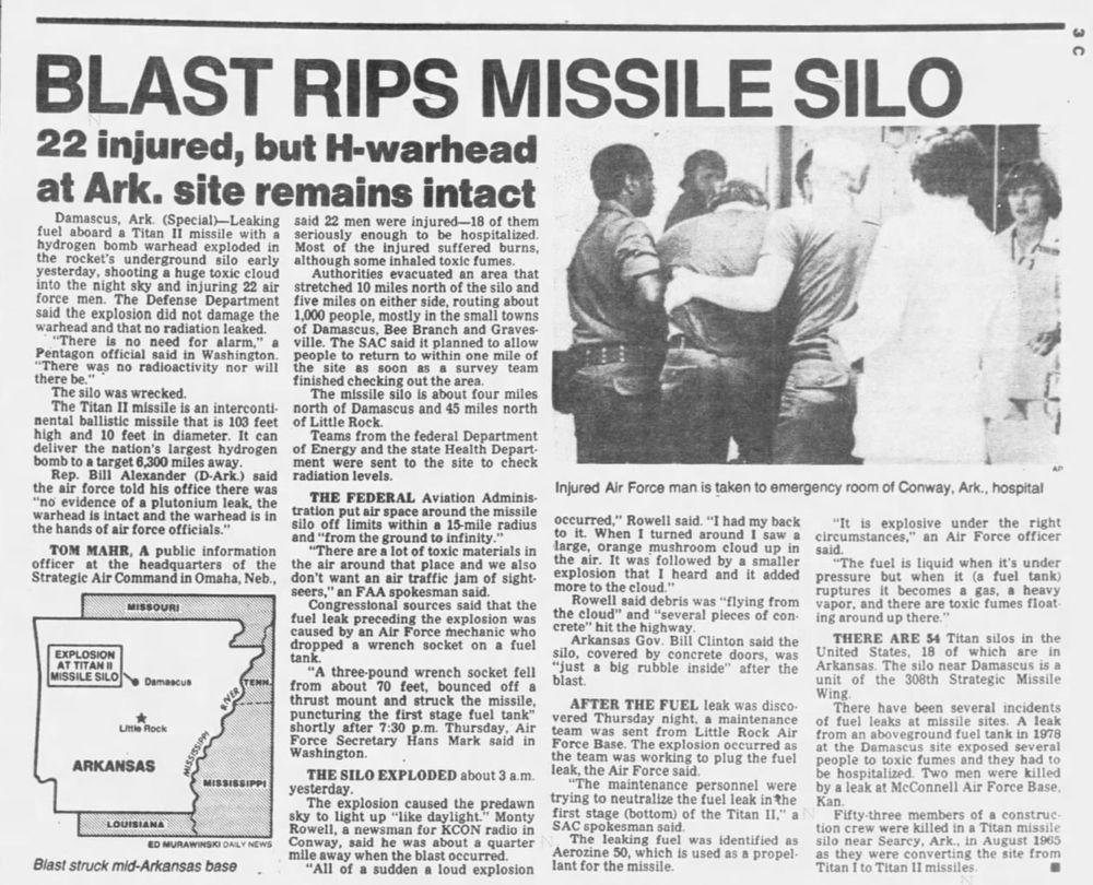 An article in an unidentified newspaper topped by a large headline: "BLAST RIPS MISSILE SILO; 22 injured, but H-warhead at Ark. site remains intact." A black and white photograph shows an injured Air Force man being taken into the emergency room at a hospital in Conway, Arkansas. A small map shows the location of the Titan II silo relative to Damascus and Little Rock.