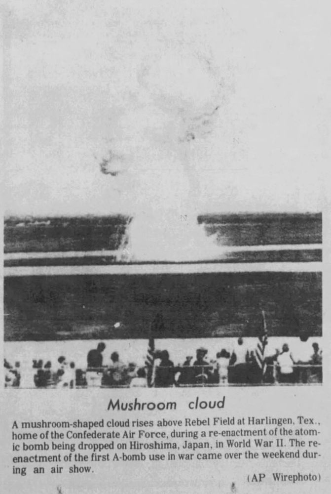 A black and white, undated (circa October 11, 1976) Associated Press wirephoto of the simulated atomic explosion at the air show:

"Mushroom Cloud

A mushroom-shaped cloud rises above Rebel Field at Harlingen, Tex., home of the Confederate Air Force, during a re-enactment of the atomic bomb being dropped on Hiroshima, Japan, in World War II. The re-enactment of the first A-bomb use in war came over the weekend during an air show."